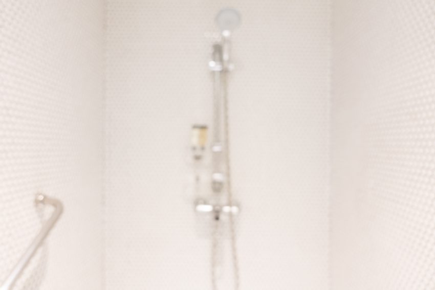 accessible shower with a wall-mounted grab bar