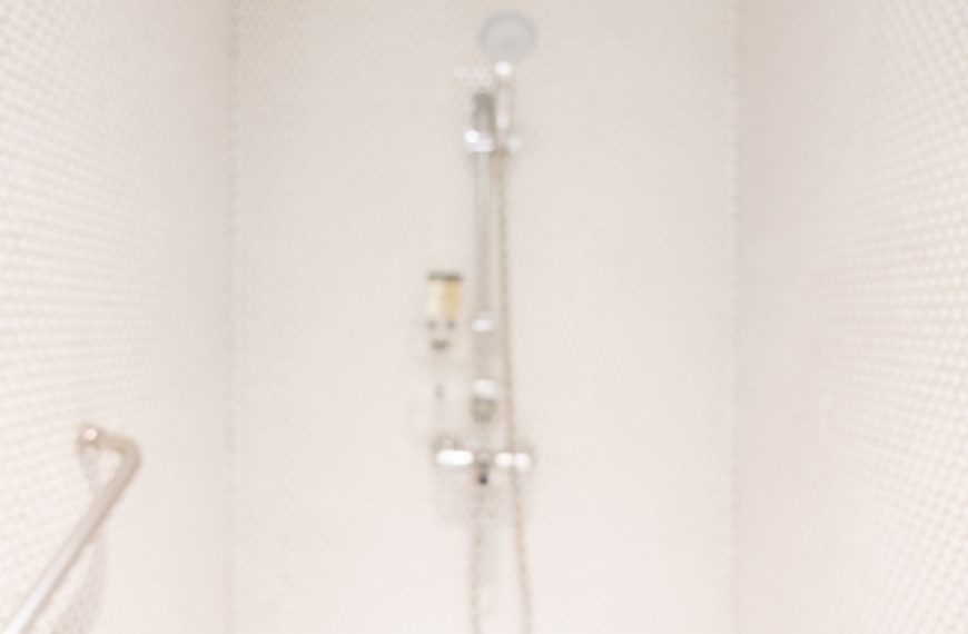 accessible shower with a wall-mounted grab bar